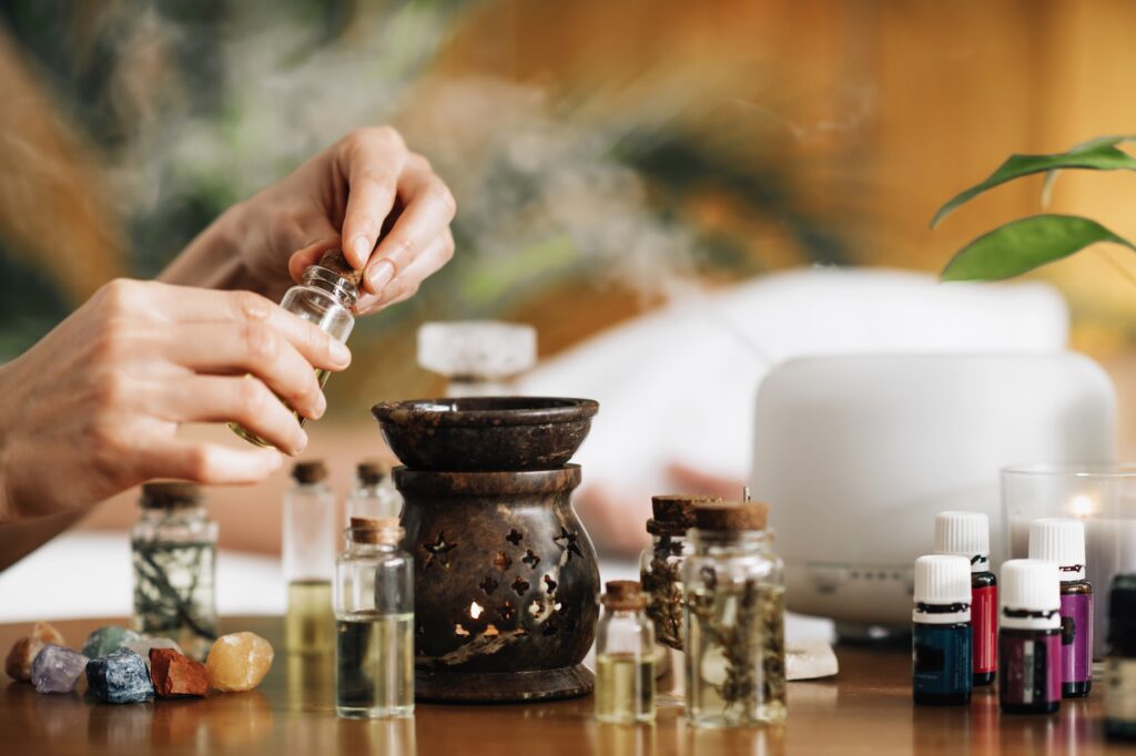 Ayurveda Aromatherapy Massage, Pouring Aromatic Oil in Essential Oil Diffuser